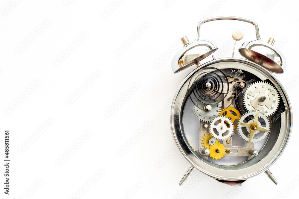 Fototapeta premium Watch mechanism with gears and wheels close up. Alarm clock mechanism