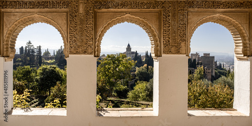 View of the Alhambra through windows of the summer palace