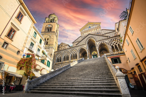 The Amalfi Cathedral bell tower in Amalfi, Italy. The church of the Apostle Saint Andrew, Roman Catholic church in the Piazza del Duomo at sunset photo