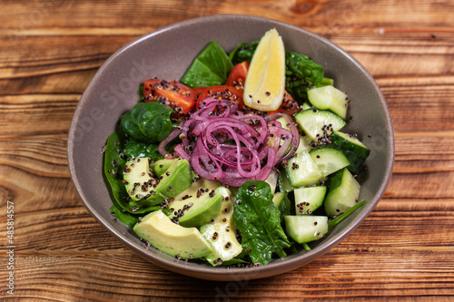 salad mix with avocado and cucumber, with balsamic dressing