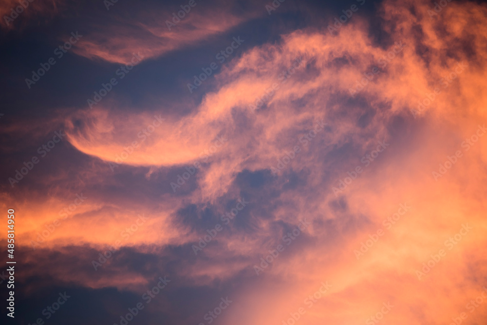 Fototapeta premium Amazing bright orange, purple and pink dramatic sunset clouds in the sky inside the Arctic Circle in Lapland, Finland