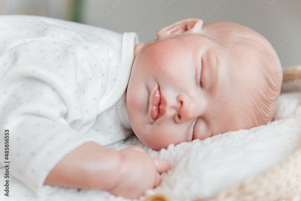 Reborn doll boy sleeps on his stomach. Close-up. Reborn doll boy sleeps on his stomach. Close-up.