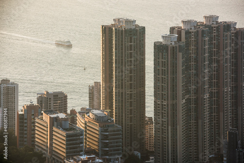 Boats in Victoria Harbour at sunset  seen from Victoria Peak  Hong Kong Island  Hong Kong  China