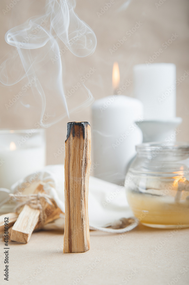 Palo Santo bars close-up and copy space. Ritual cleansing with sacred ibiocai, meditation, aromatherapy with incense and candles.. - obrazy, fototapety, plakaty 