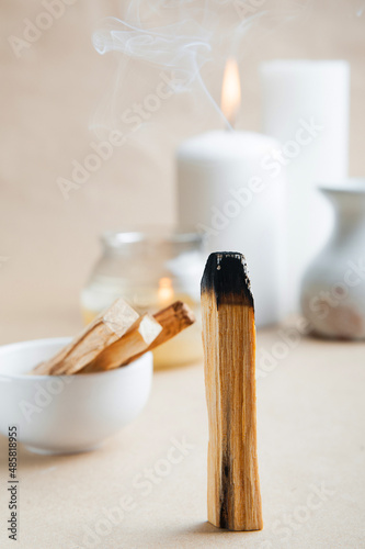 Palo Santo bars close-up and copy space. Ritual cleansing with sacred ibiocai, meditation, aromatherapy with incense and candles..