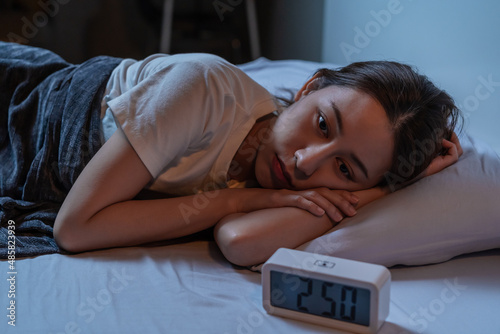 фотографія Sad worried and stressed, asian young beautiful, pretty woman, girl suffering from insomnia, awake in the night in bedroom, tired and exhausted