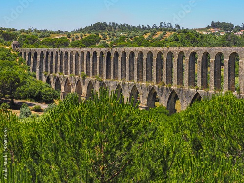 Tomar Aqueduct or Aqueduto de Pegoes, ancient stone masonry building, amazing monument. It was built in the 17th century to bring water to the convent of Christ in Tomar under command of king Philip I photo