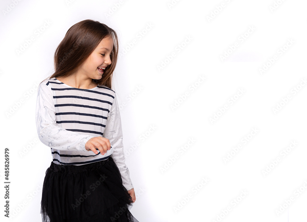 Playful kids, funtime concept. Portrait of cute girl 8 years old wearing light clothes and dancing isolated on white background. Mother's Day, love family, parenthood childhood concept Playful kids, funtime concept. Portrait of cute girl 8 years old wearing light clothes and dancing isolated on white background. Mother's Day, love family, parenthood childhood concept