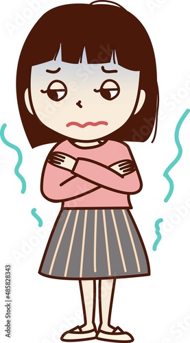 悪寒がする顔色の悪い若い女性。