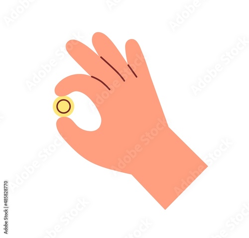 Gold coin in fingers. Hand holding money change, gesturing OK. Financial bonu...