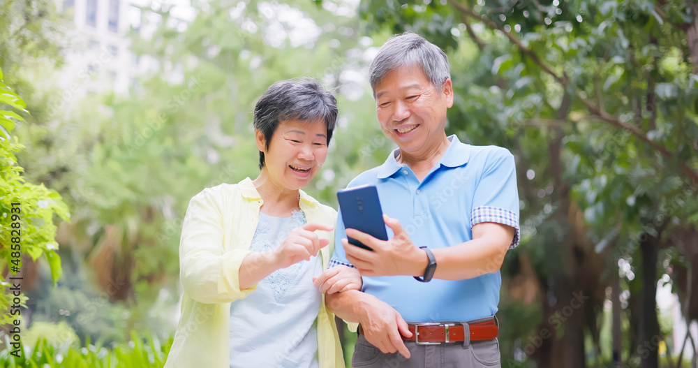 elderly couple using mobile elderly couple using mobile