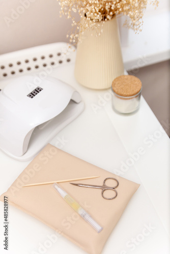 manicure and pedicure equipment for nail bar set on light background