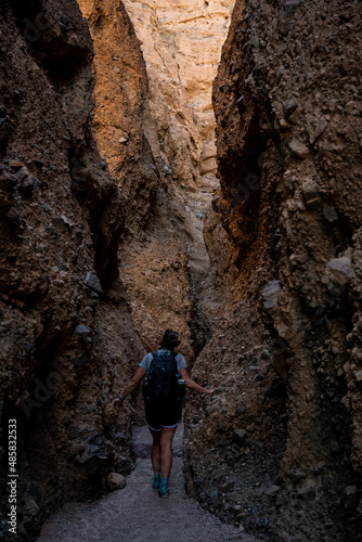 Hiker Slows Down To Admire The Walls Of Sidewinder Canyon