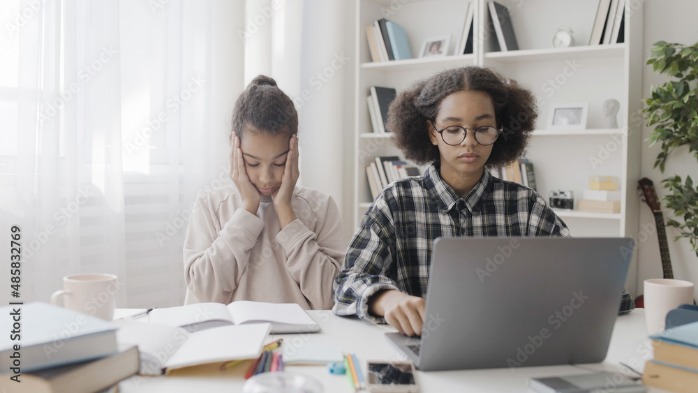 Confused classmates thinking of math problem, looking for answers in internet, studying at home, education Confused classmates thinking of math problem, looking for answers in internet, studying at home, education
