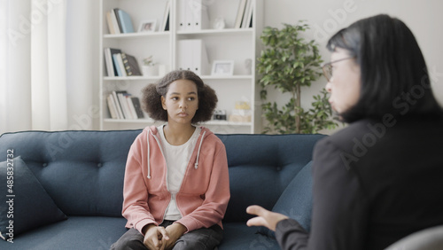 Fotografija Therapist talking to sad teen girl during counselling session, mental health