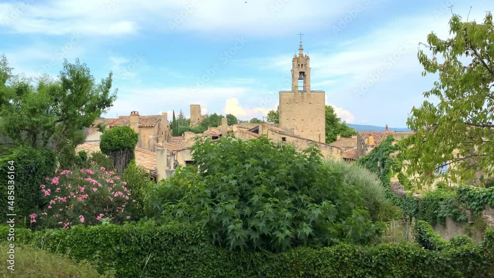 Clock tower of the village of Cucuron in the Luberon valley in Provence, France Clock tower of the village of Cucuron in the Luberon valley in Provence, France