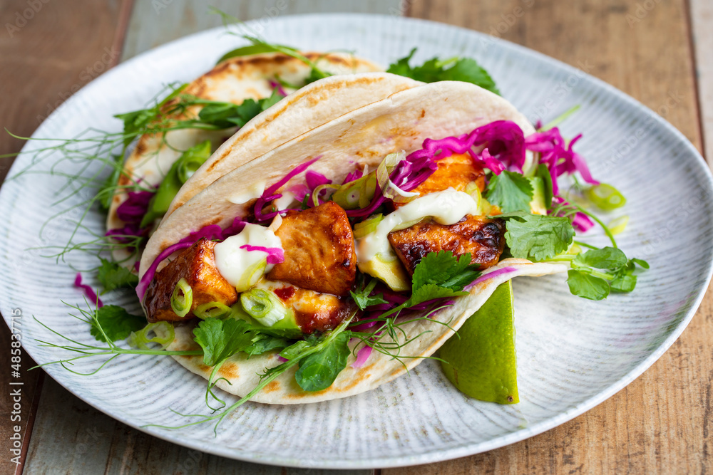Tacos with salmon, pickled red cabbage, wasabi mayo and pea shoots Tacos with salmon, pickled red cabbage, wasabi mayo and pea shoots