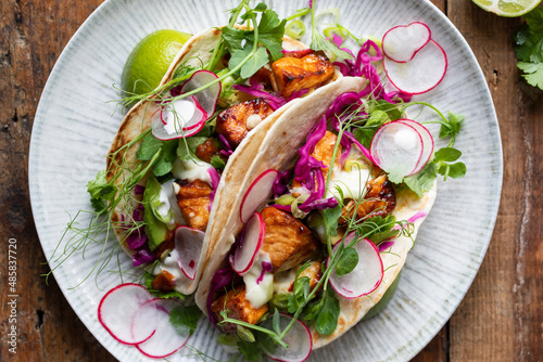 Tacos with salmon, pickled red cabbage, wasabi mayo and pea shoots