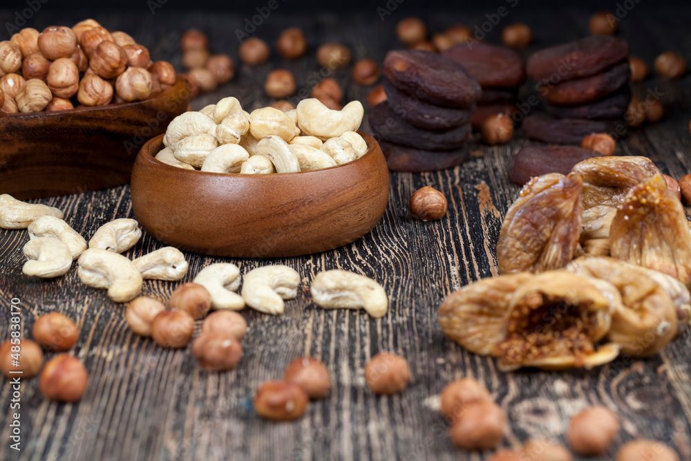 dried cashew nuts on a wooden table