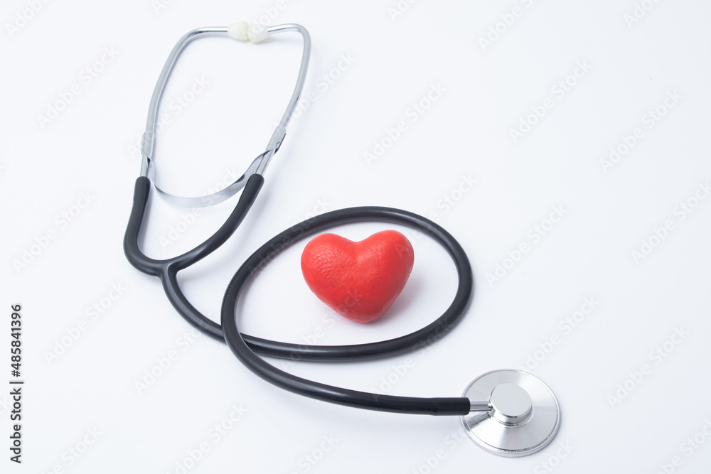 Red heart with medical stethoscope. Insurance health or heart treatment, mental health concept Red heart with medical stethoscope. Insurance health or heart treatment, mental health concept