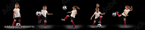 Full-length portrait of little girl, child, training, playing football isolated over black studio background. Collage