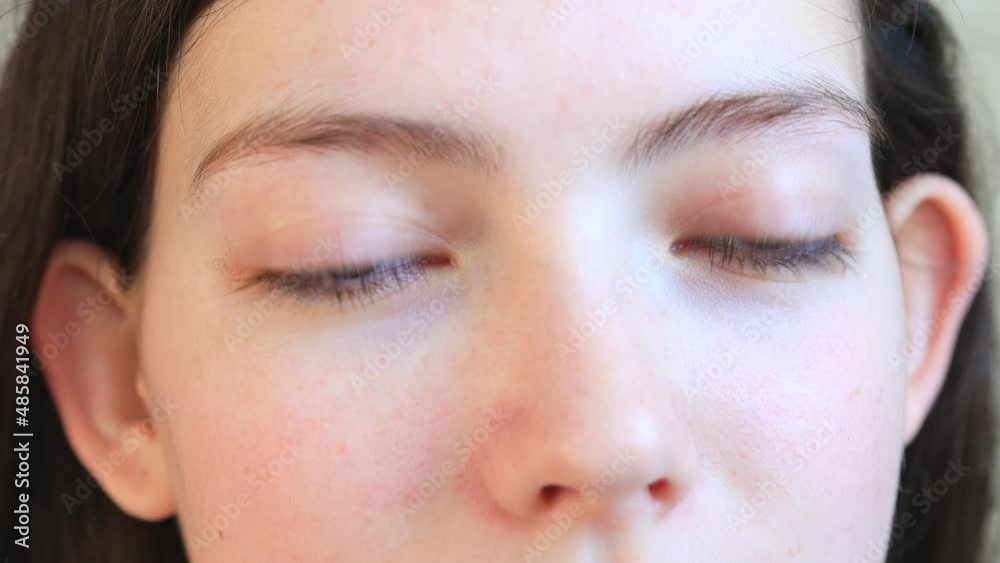 close-up of the eyes of a woman who removes contact lenses close-up of the eyes of a woman who removes contact lenses