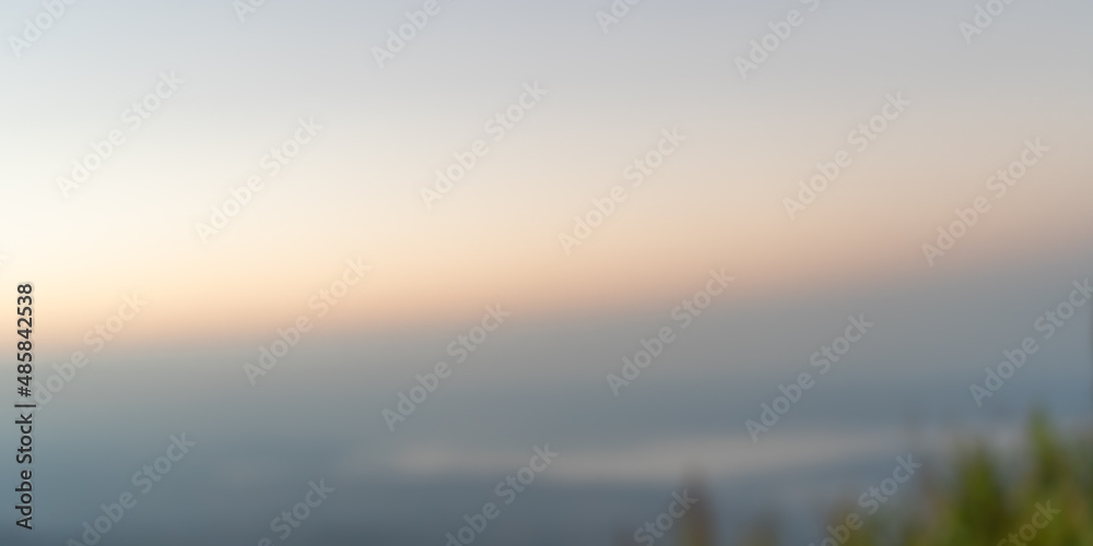 blurred background of sunrise over the mountain blurred background of sunrise over the mountain