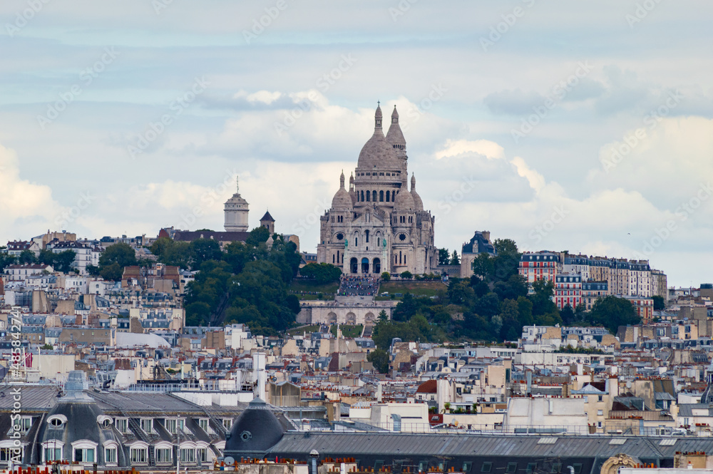 Paris cityscape from above. Montmartre hill and Sacre Coer church stand out in the view