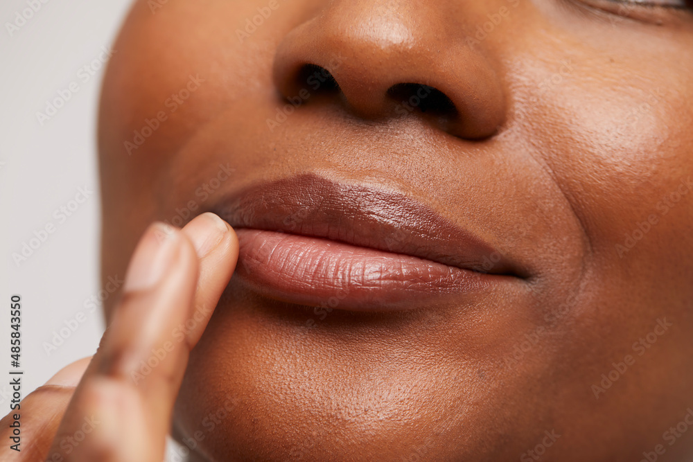 Close-up of woman touching lips - obrazy, fototapety, plakaty 