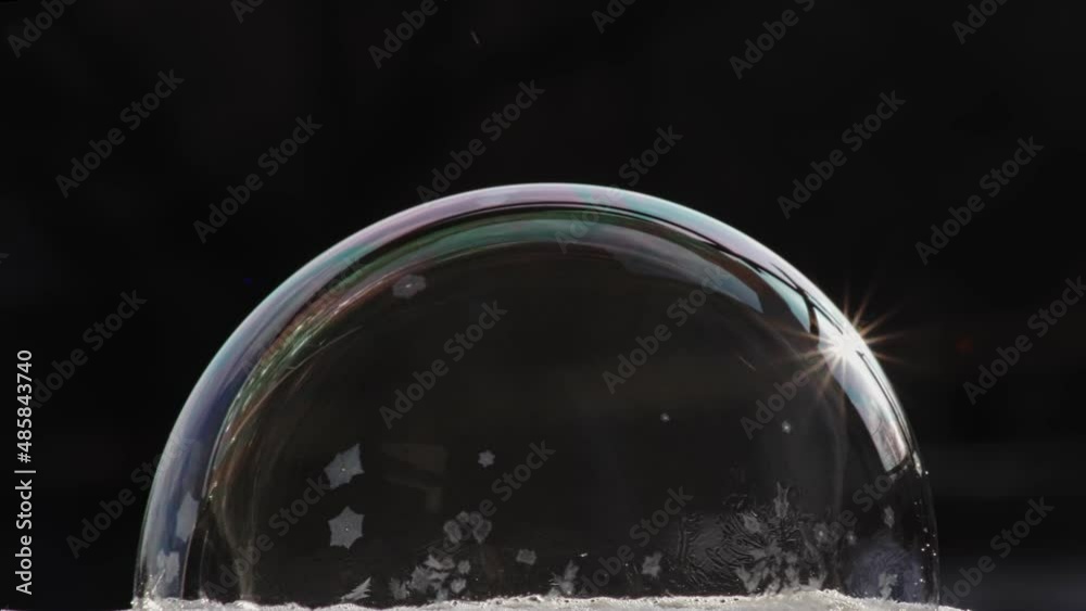Ice covers the smooth surface of the transparent ball. Soap bubble icing Ice covers the smooth surface of the transparent ball. Soap bubble icing