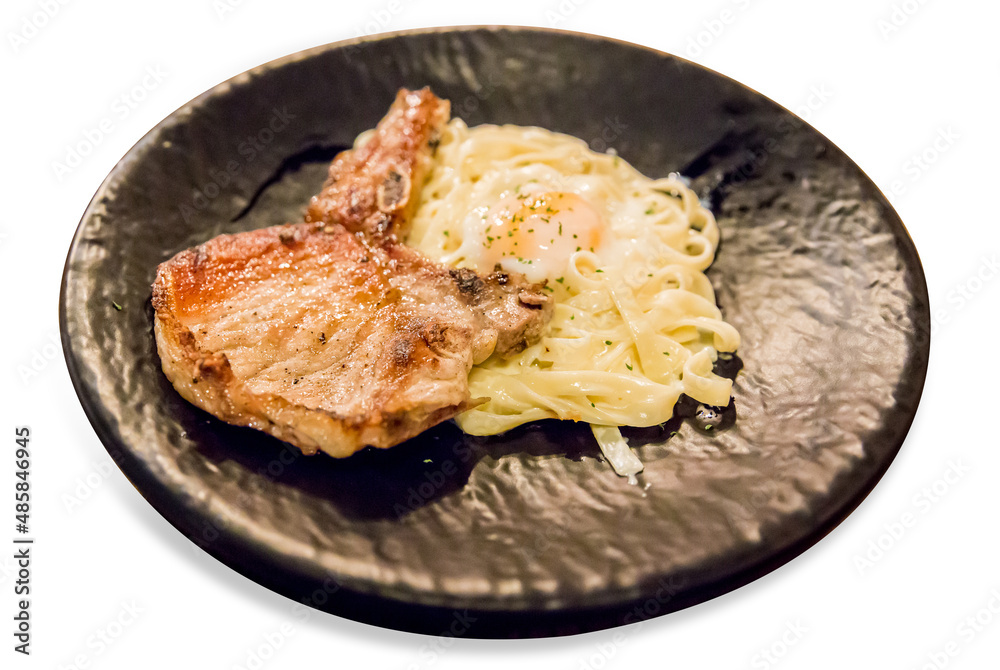 Die cut of Grilled spicy barbecue kurobuta pork steak with egg and pasta on white isolated
