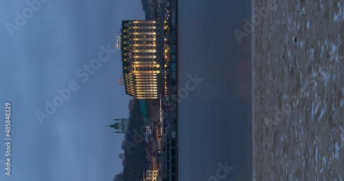 Timelapse Day to Night Right Bank Dniepro River in Kyiv, Ukraine. Podil is the old part of the city. photo