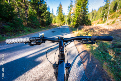 Fototapeta Naklejka Na Ścianę i Meble -  A bike ride along the trail in the Tatra National Park on a sunny day. Poland