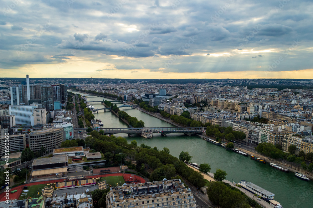 Aerial view of the city of Paris  with the nice Seine river seen from the Tour Eifel