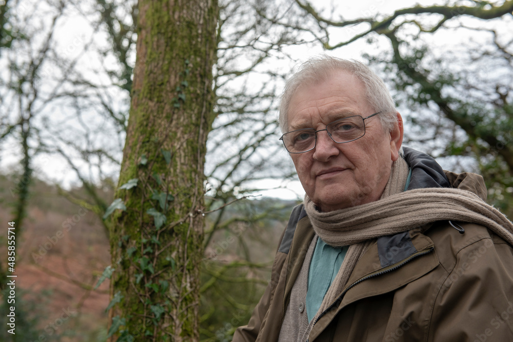 Portrait of active senior man walking outdoors in nature Portrait of active senior man walking outdoors in nature