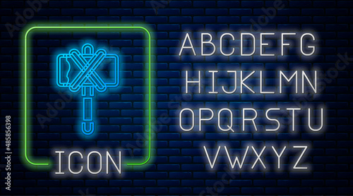 Glowing neon Medieval axe icon isolated on brick wall background. Battle axe, executioner axe. Medieval weapon. Neon light alphabet. Vector