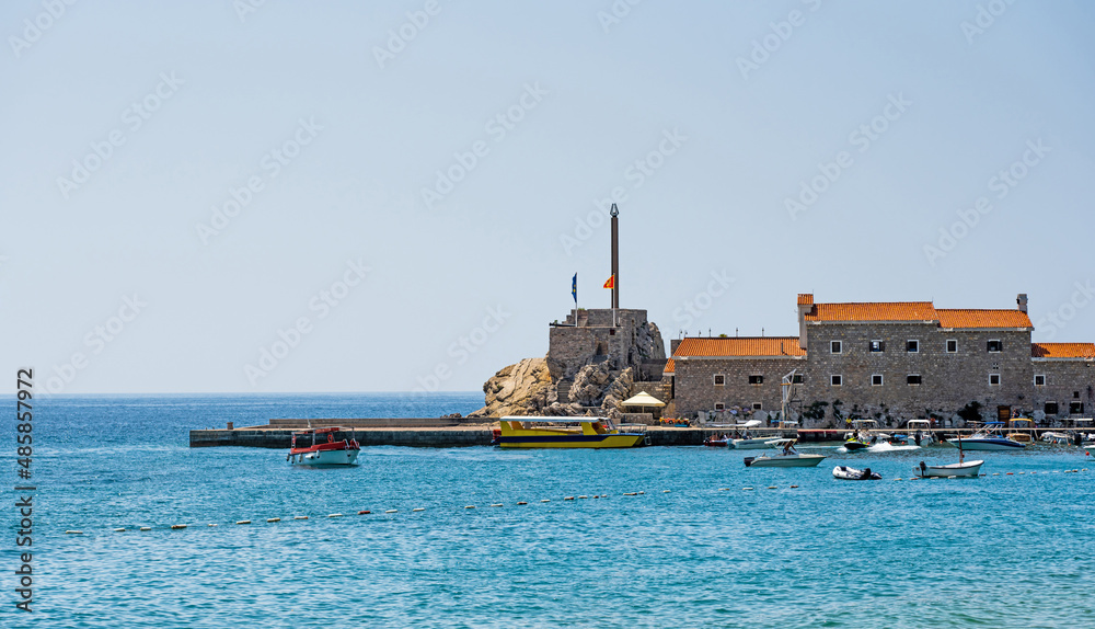 Yachts port in Montenegro in Adriatic sea. Boats pier in sunny day in Mediterranean sea