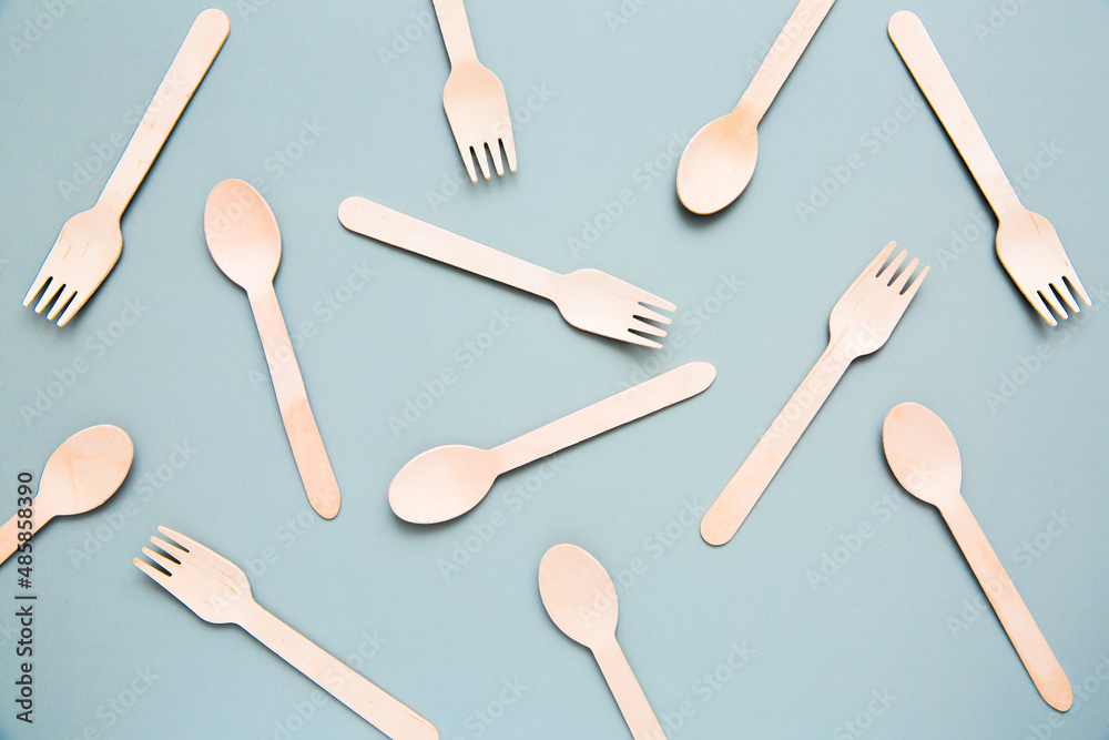 Top view of many wooden fork, spoon, pattern. Natural eco-friendly disposable utensils or creative idea design. Top view of many wooden fork, spoon, pattern. Natural eco-friendly disposable utensils or creative idea design.
