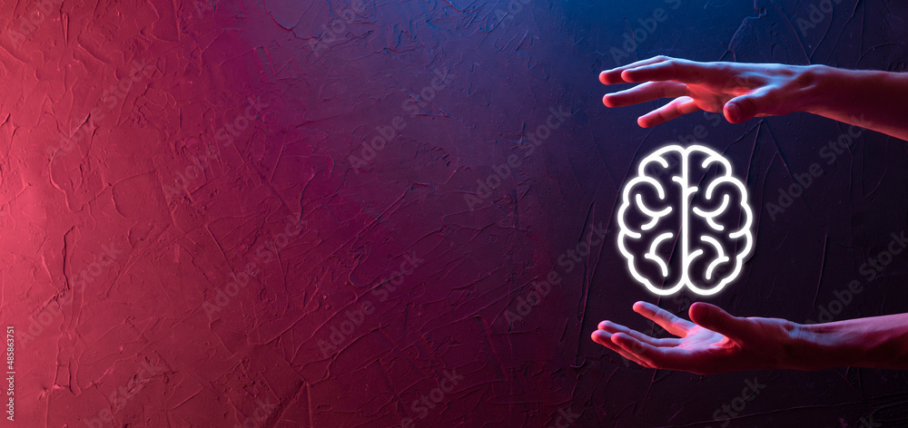 Male hand holding brain icon on neon red,blue background. Artificial ...