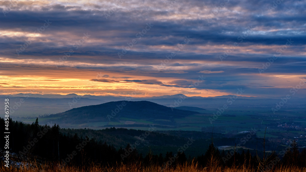 Sunset with dramatic cloudy sky over mountains shape, beautiful nature landscape Sunset with dramatic cloudy sky over mountains shape, beautiful nature landscape