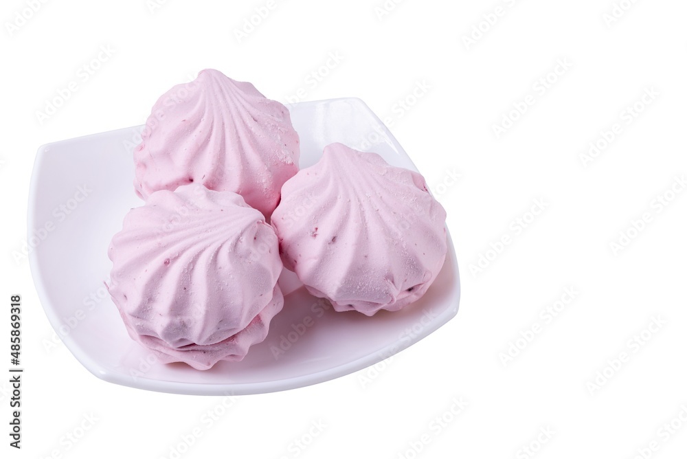 Close up view of a pink marshmallow on saucer isolated on a white background.