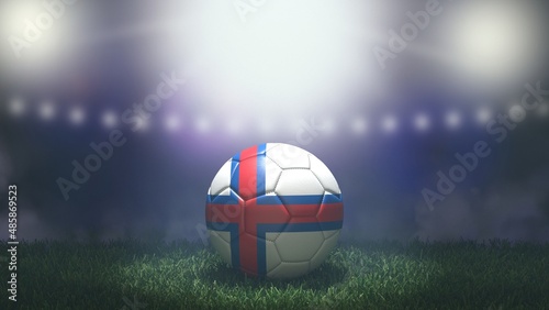 Soccer ball in flag colors on a bright blurred stadium background. Faroe Islands. 3D image