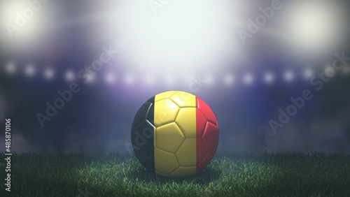Soccer ball in flag colors on a bright blurred stadium background. Belgium. 3D image