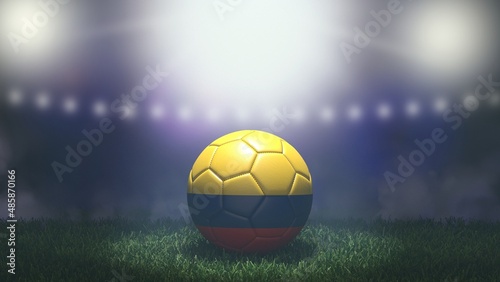 Soccer ball in flag colors on a bright blurred stadium background. Colombia. 3D image