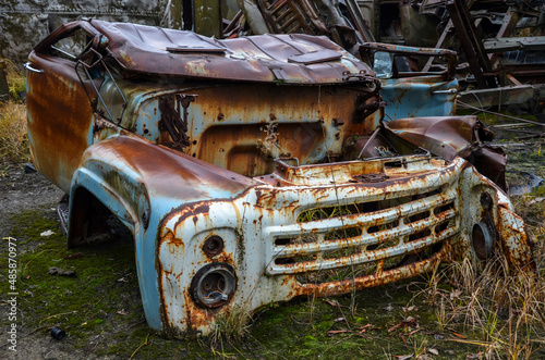 Abandoned cab of an old rotten rusty soviet truck. Recycling scrap