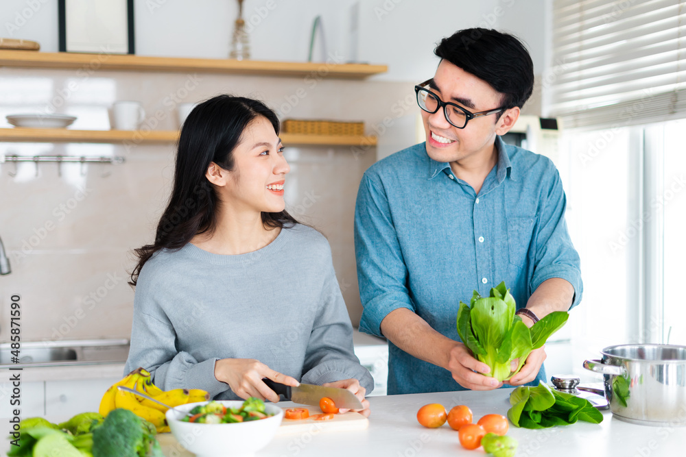 image of a couple cooking together image of a couple cooking together