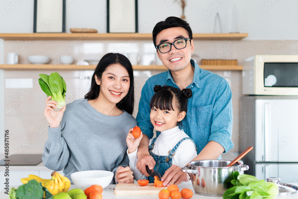 image of an asian family cooking at home