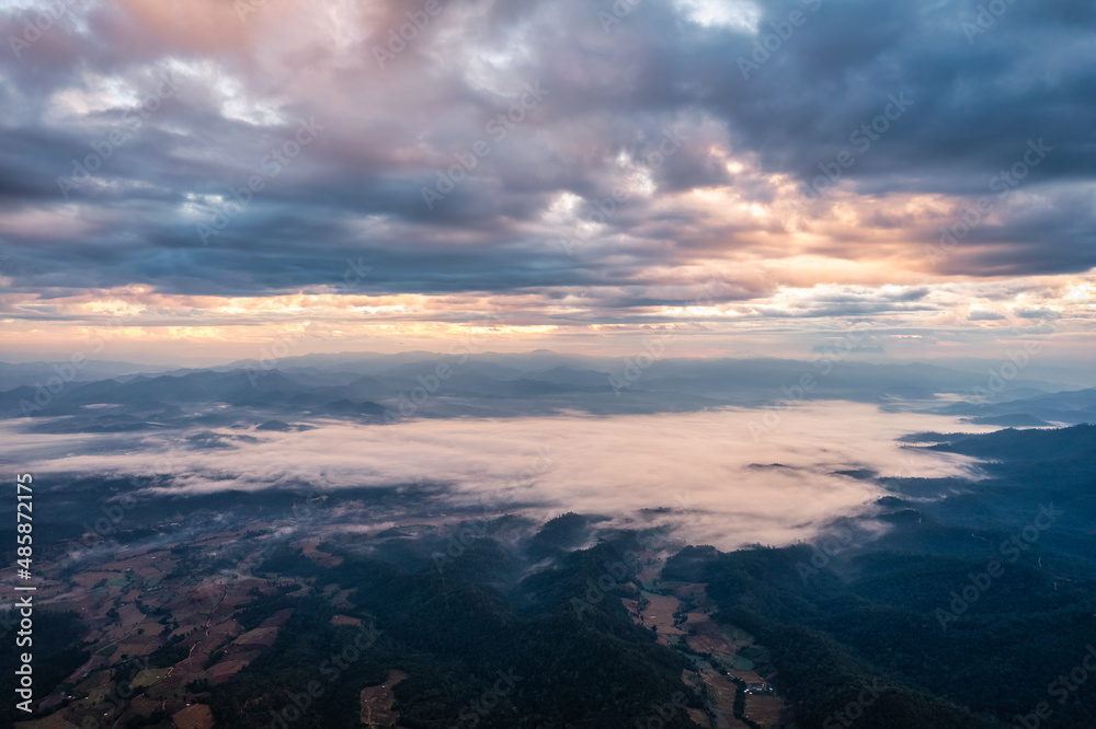 Fototapeta premium Viewpoint of Doi Dam with Doi Luang Chiang Dao mountain and foggy in the valley at the morning in national park