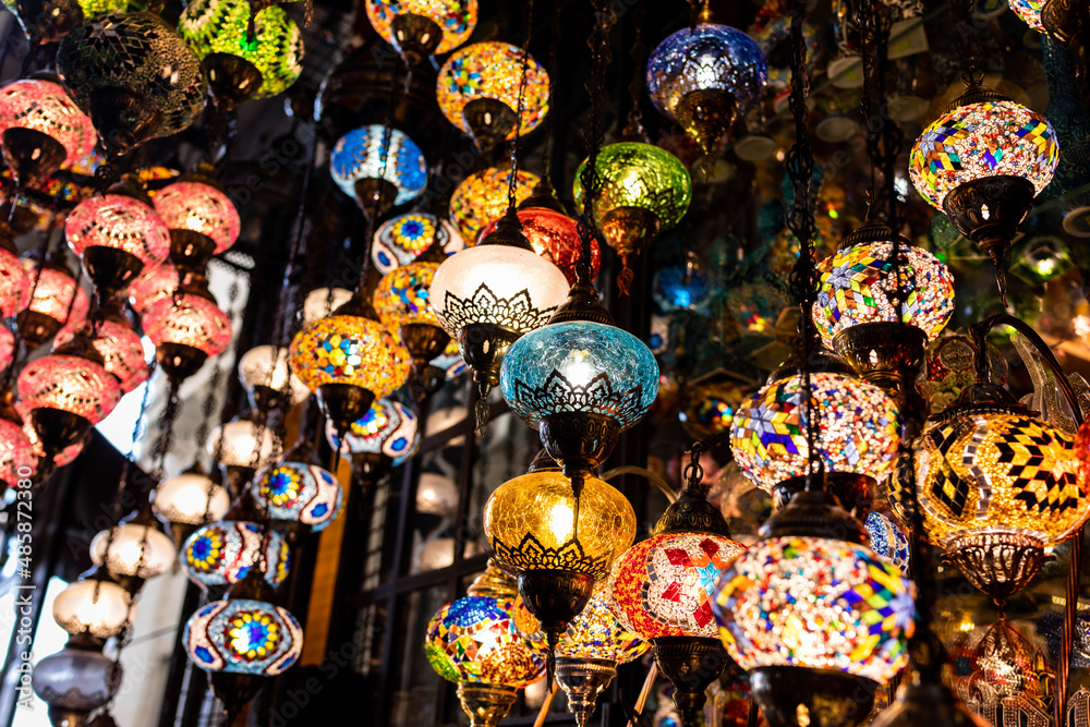 Obraz premium Colorful mosaic hanging lantern lamps, a popular turkish souvenir for sale at a gift shop on a street of Istanbul, Turkey