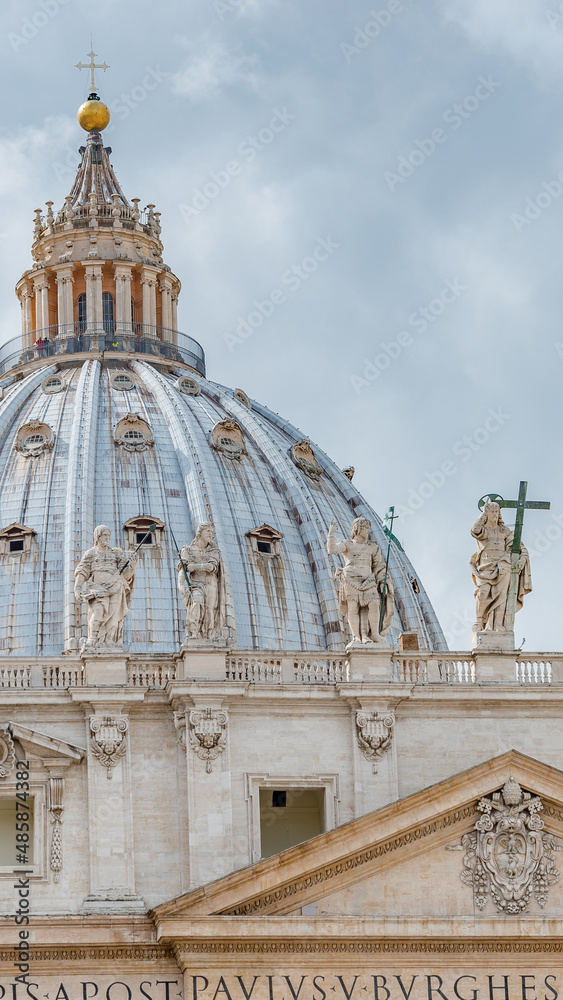 Dramatic view over Saint Peter Basilica in Vatican city, in the center of Rome, Italy, with heavy clouds.